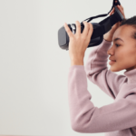 Woman putting on VR headset