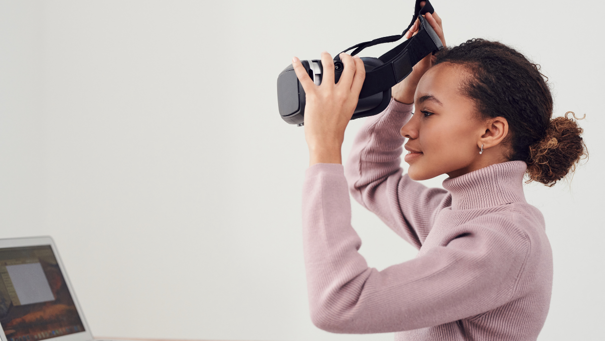 Woman putting on VR headset
